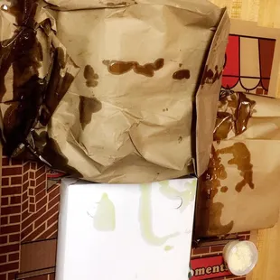 How my order was delivered. The bottom of my pizza box was soaked as well.