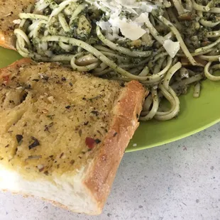 Pesto and clam pasta with garlic bread