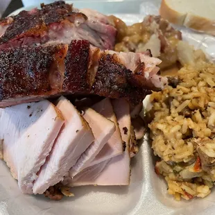 ows a plate of meat and rice