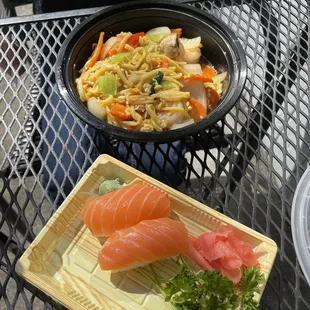 a plate of sushi and a bowl of noodles