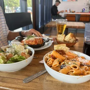 Ceasar salad, lasagna, Alfredo pasta and focaccia bread.
