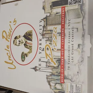 a hand holding a pizza box