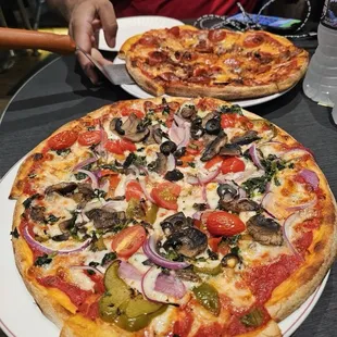 Veggie Pizza and Meat Lovers pizza.