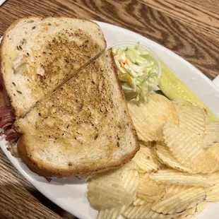 a sandwich and chips on a plate