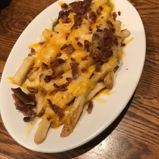 Fries with bacon and cheese.