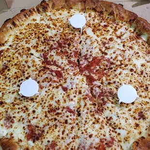 Cheesy giant pizza, half pepperoni (under the cheese), and stuffed crust.