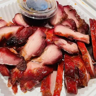 a plate of sliced pork