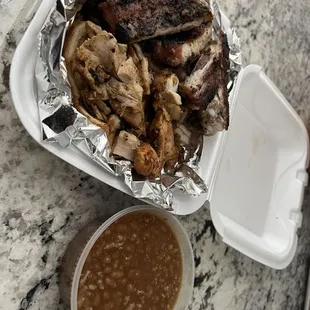 Rib and chicken combo and side of baked beans.
