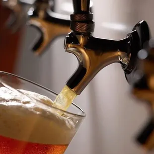 a beer being poured into a glass