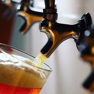 a beer being poured into a glass