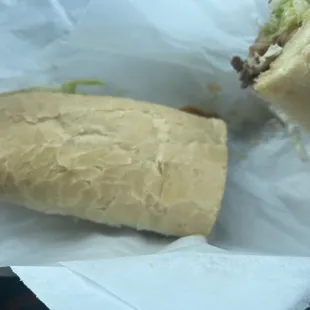 Philly cheesesteak with cheese, mushrooms, tomatoes and lettuce