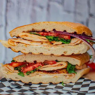 two halves of a sandwich stacked on top of each other