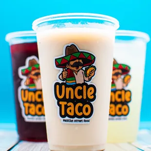 three drinks in plastic cups
