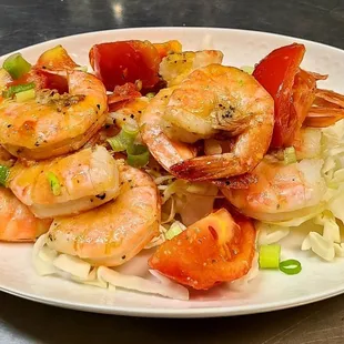 a plate of shrimp and vegetables