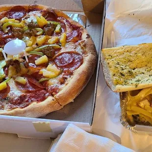 Mountain pizza - pineapples instead of onions, chicken broccoli fettuccine.