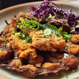 Fried chicken thigh and hush puppy bubble waffle