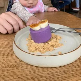 a baby eating a dessert