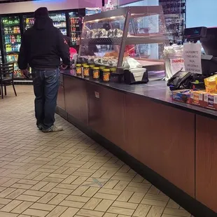 a man walking by the counter