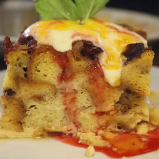 Uncle&apos;s Fish Market &amp; Grill&apos;s Bread Pudding is pudding with dried cranberries, peaches, &amp; macadamia nuts with a creme anglaise.