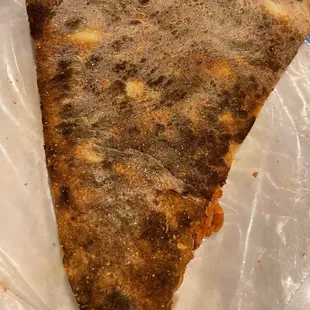 Bottom crust of the all meat pizza.