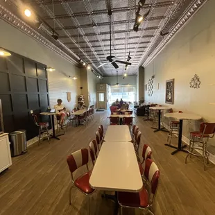 a dining room with tables and chairs