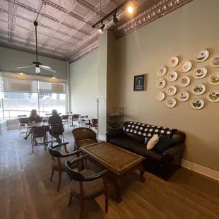a dining room with plates on the wall
