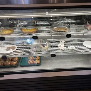 a display case filled with pastries
