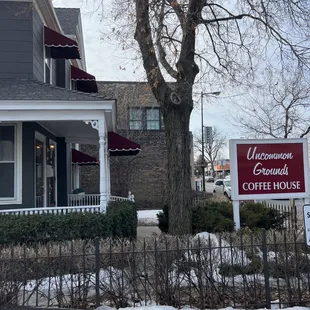 a house with a sign for a coffee house