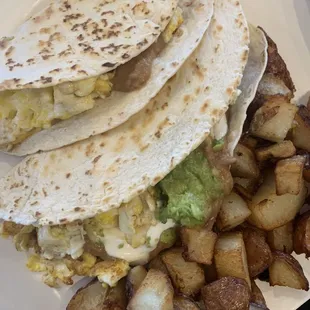 Baleadas, scrambled eggs, refried beans, avocado and feta cheese