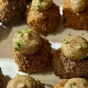 Nom Nom Balls: Mushroom risotto balls, porcini powder, black garlic aioli