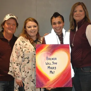 Family love on proposal paint and sip night.