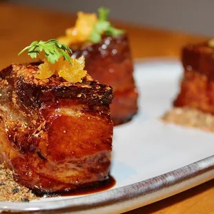 The Pork Belly Bites were made with Milk Braised Pork Belly, Zaa&apos;tar, Apricot &amp; Pomegranate Glaze.