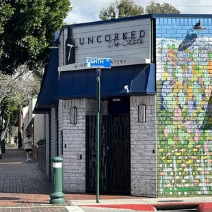 a brick building with a mural on it