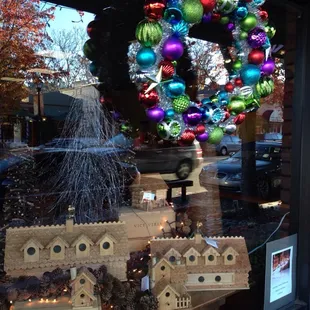 a window display of christmas ornaments