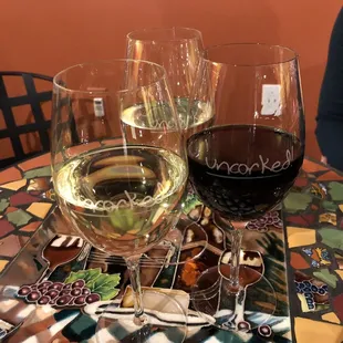 two glasses of wine on a table