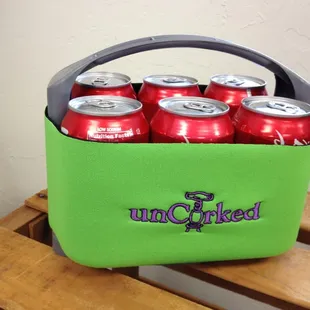 six cans of beer in a cooler
