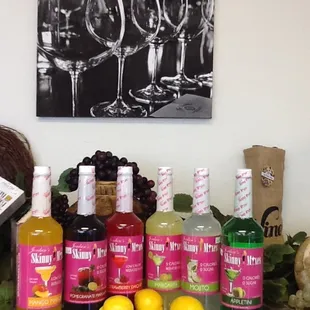 bottles of wine, lemons, and grapes