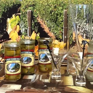 jars of pickled olives on a table