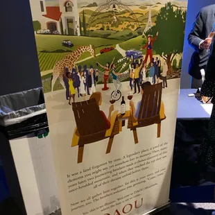 a man standing next to a poster