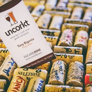 Tony's business card in the cork bar top.