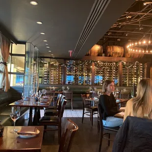 people sitting at tables in a restaurant