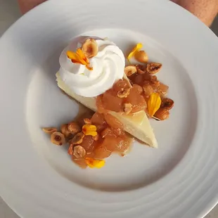 White Chocolate Cheesecake- pear chutney, whipped cream, hazelnuts.