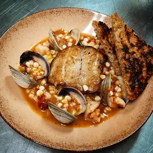 Fish Stew- seared flounder, shrimp, clams, sour corn, smoked tomato broth, saffron rice.