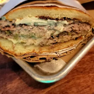 Hatch chili burger. Two 4 oz patties, American cheese, diced Hatch Chili, shaved onion and mayo