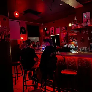 people sitting at a bar