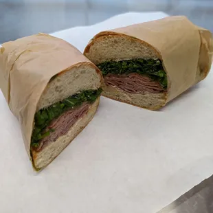 The Dodge.  Tahini garlic spread, soy molasses marinated kale, caramelized onions, sliced red onions and sliced roast beef on ciabatta.