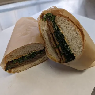The Vegan Dodge. Tahini garlic spread, soy molasses marinated kale, seitan, caramelized onions and red onions on ciabatta.
