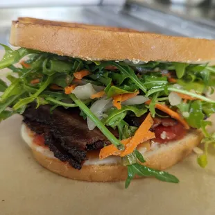 The BLTish.  pepper bacon, tomato jam, provolone cheese &amp; arugula slaw (with carrots, walnuts and pickled onions &amp; fennel)