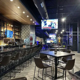 Inside. Open layout with games for kids and a ton of tvs