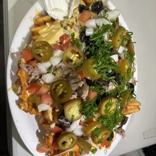 Kalua Pig Nachos on waffle fries